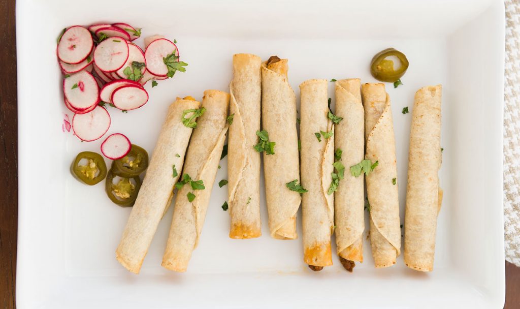 crispy taquitos on a plate